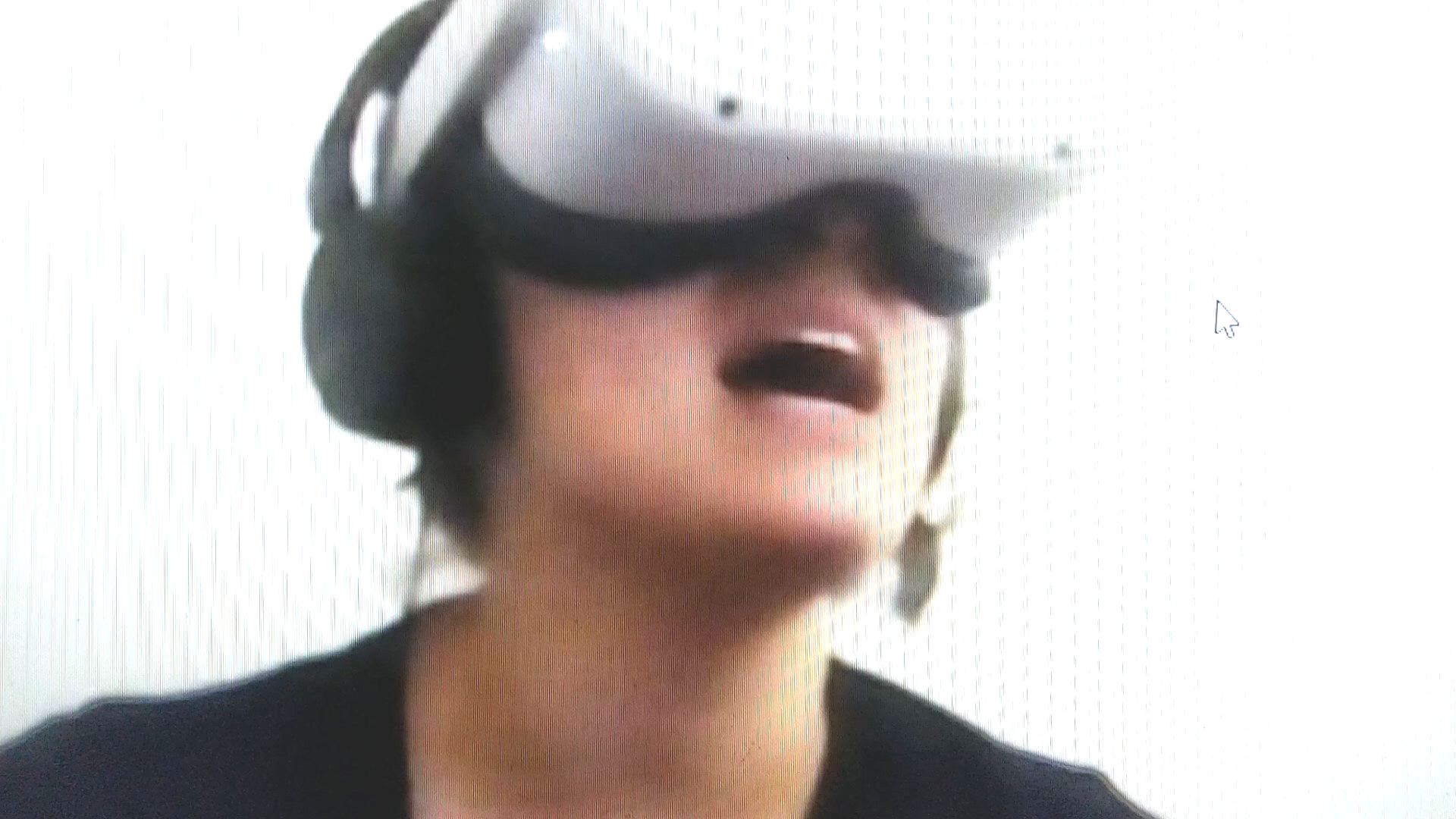 Performer singing in a VR Headset, while moving her own avatar in VR